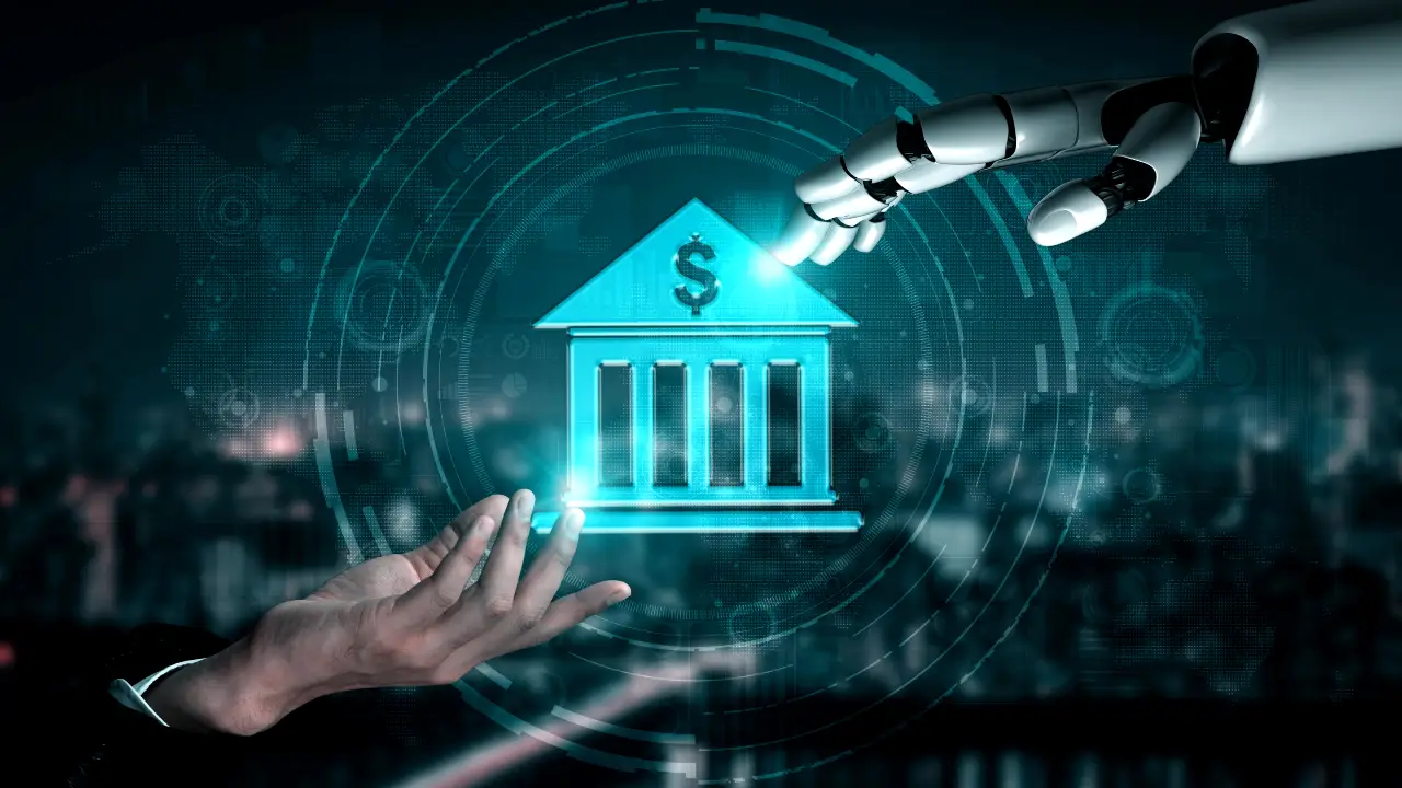 Una mano umana e una mano robotica si dirigono verso un'icona di banca luminosa con il segno del dollaro, che simboleggia l'intersezione tra tecnologia, intelligenza artificiale e attività bancaria. Sullo sfondo appare la grafica di un'interfaccia digitale.