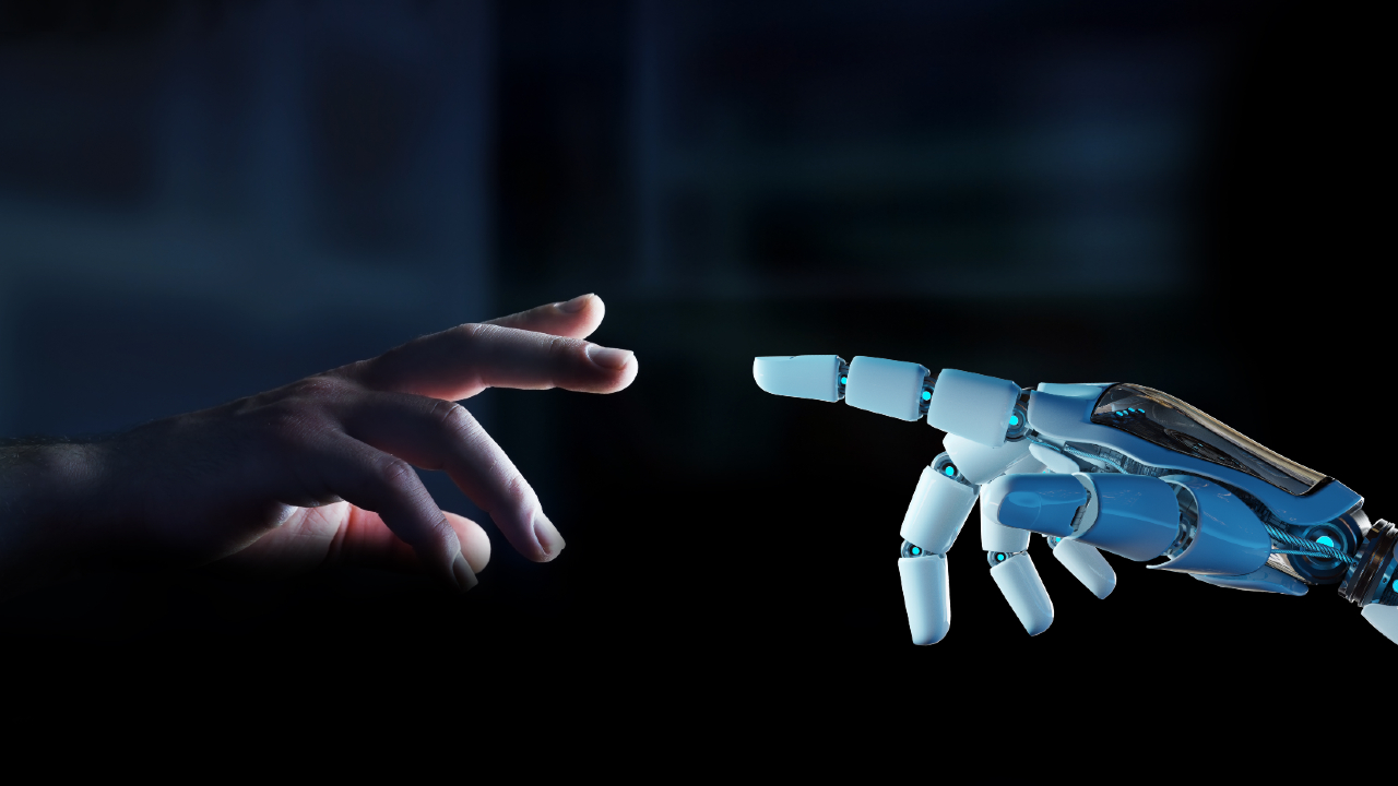 Una mano umana e una mano robotica si protendono l'una verso l'altra, con gli indici che quasi si toccano su uno sfondo scuro, a simboleggiare il legame tra l'uomo e la tecnologia e il ruolo in evoluzione della banca in questa relazione.