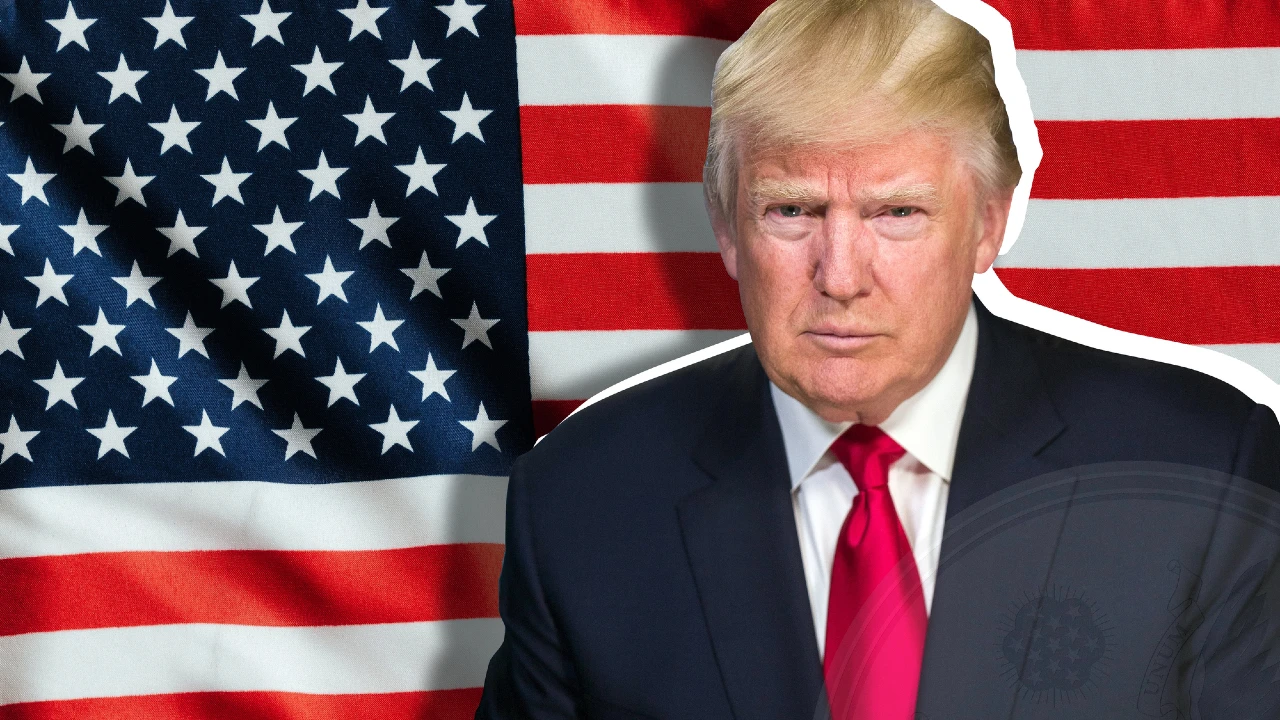 Un uomo in giacca e cravatta rossa si trova di fronte a una bandiera americana e guarda direttamente la telecamera con un'espressione seria, che riflette la gravità di una possibile chiusura del governo.