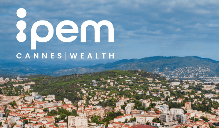 The ipem Cannes Wealth logo appears over a panoramic view of Cannes, France, showing clusters of buildings, green hills, and mountains under a partly cloudy sky.
