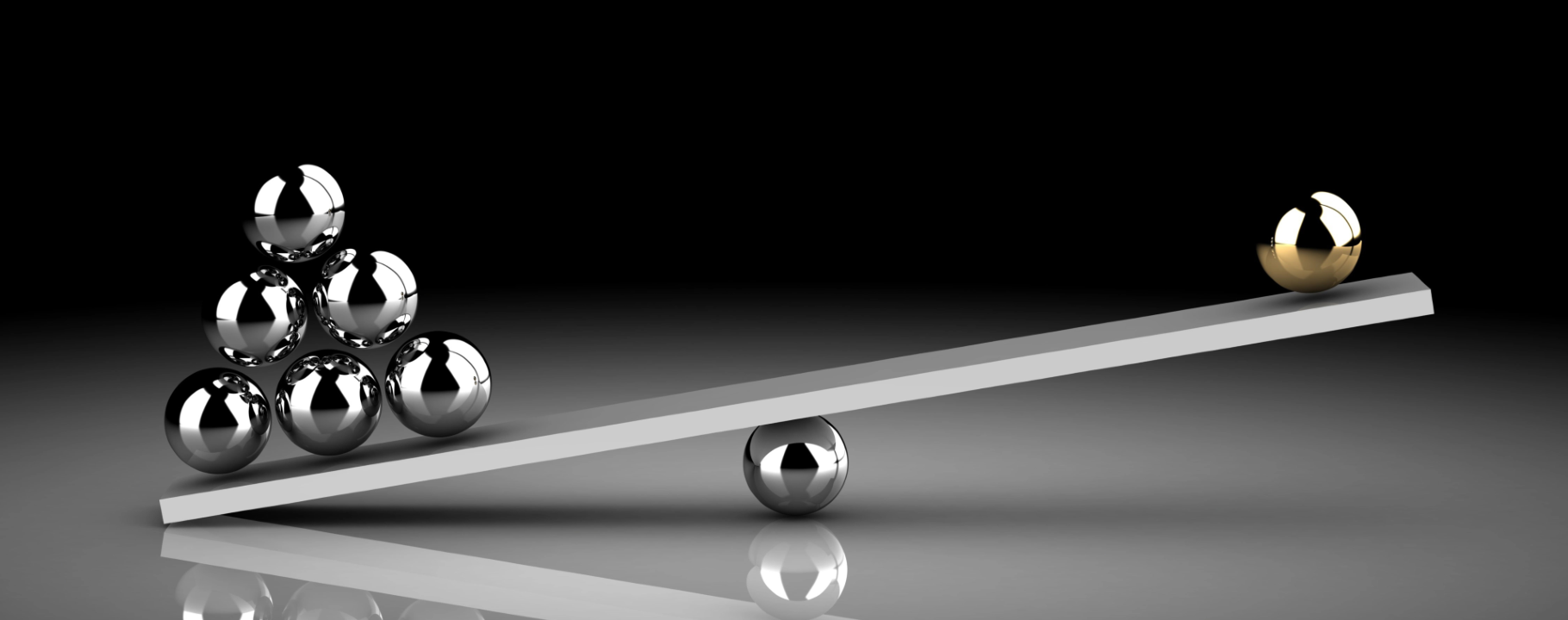 Bilancia stilizzata con sfere metalliche di peso diverso, simbolo dell’equilibrio tra rischio, crescita e protezione nei portafogli globali.