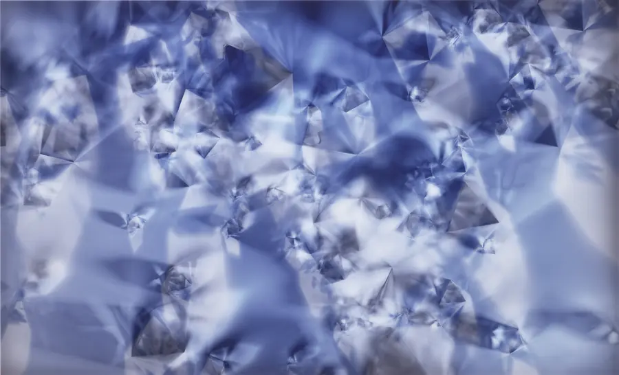 Superficie blu e bianca sfaccettata, simile a cristalli o ghiaccio.