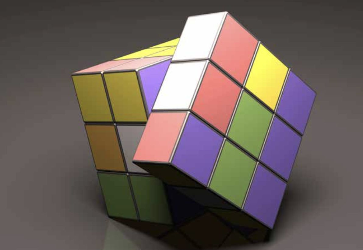 Un cubo di Rubik parzialmente risolto con la sezione superiore attorcigliata, che mostra vari quadrati colorati, tra cui verde, giallo, arancione, viola, rosso e bianco, su uno sfondo grigio neutro.